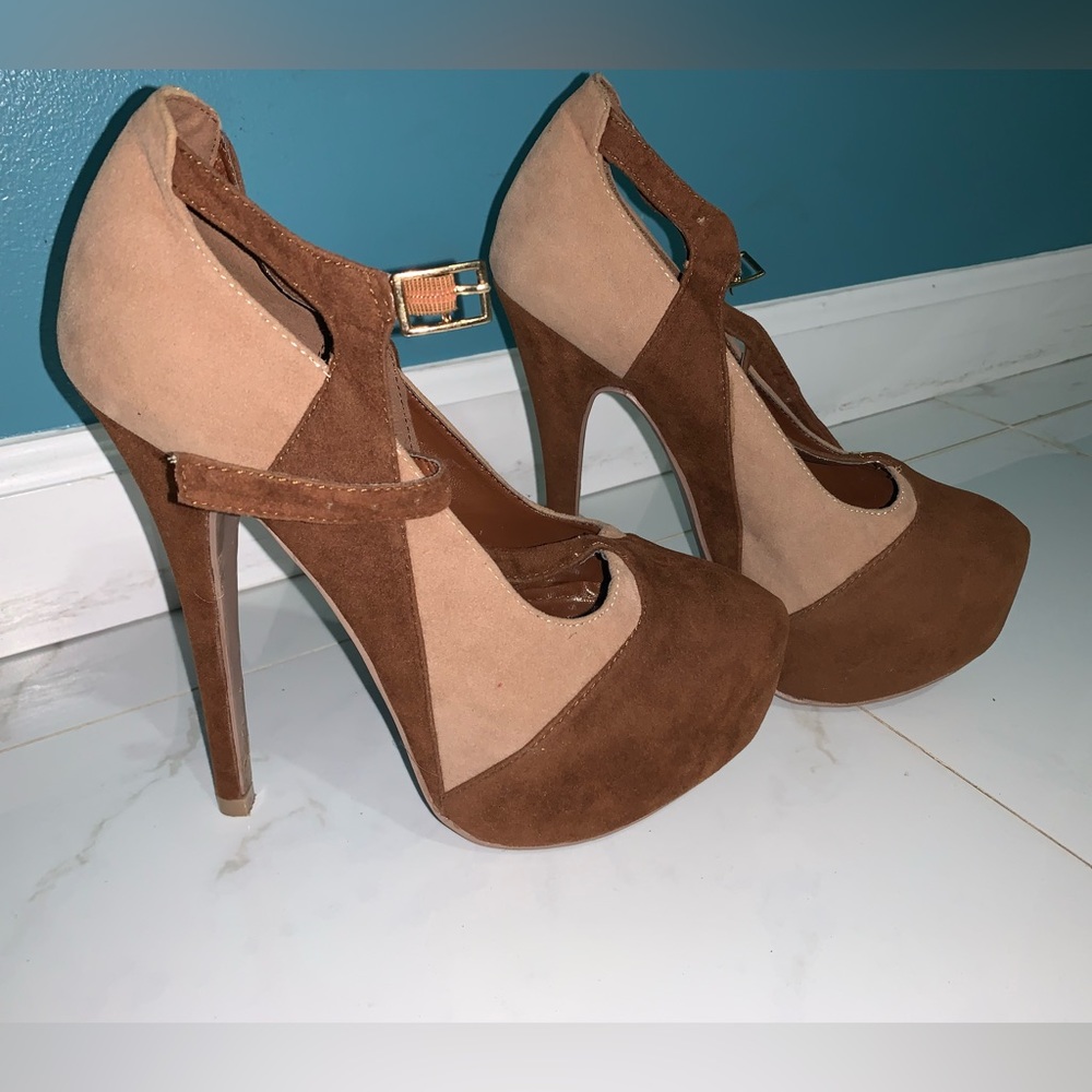 Beige & brown high heel pumps.